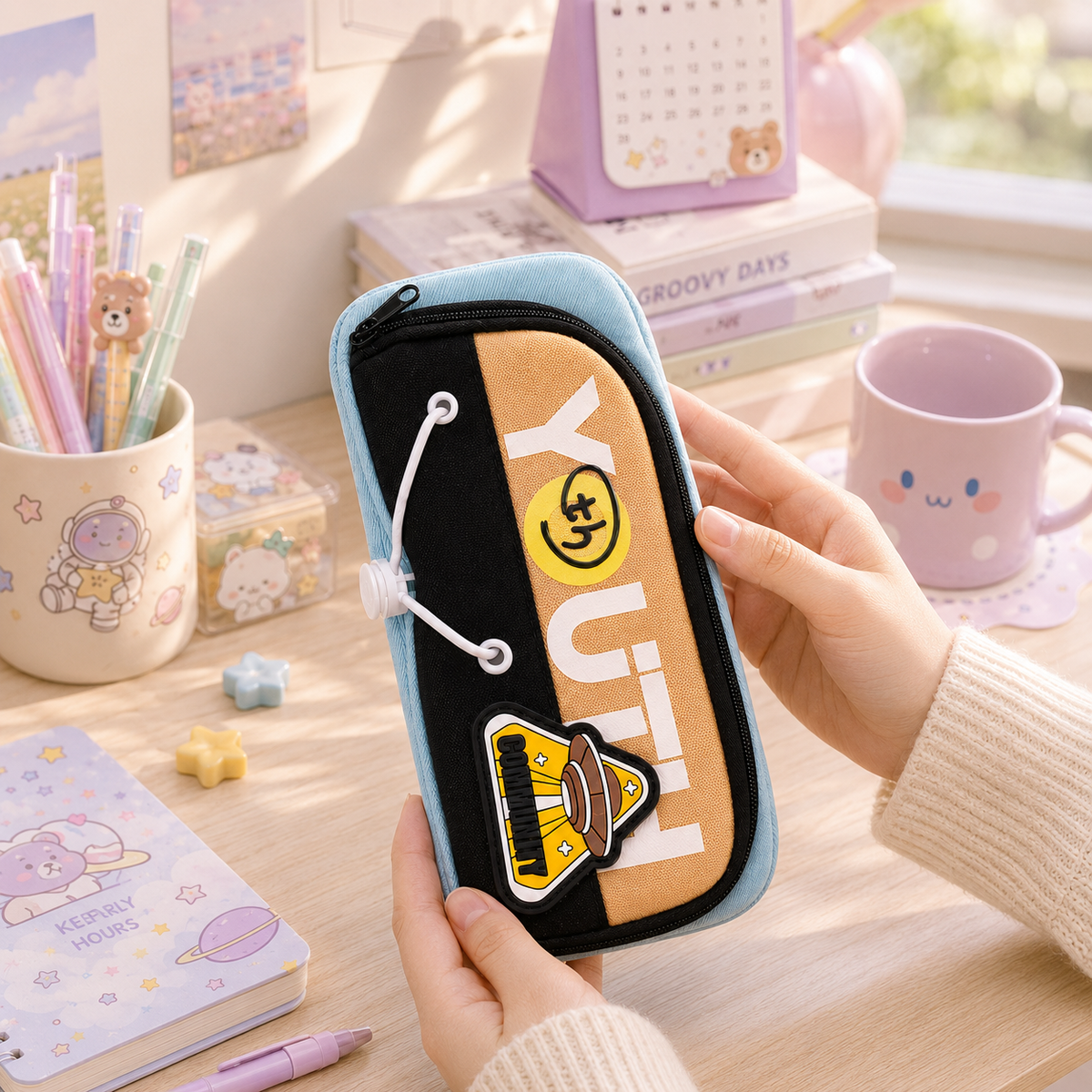 Youth Smiley Patch Pencil Pouch - held in hand